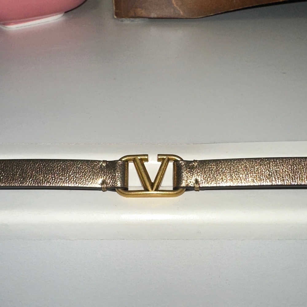 Valentino Gold Logo “V” bracelet w Bronze Leather Strap.
